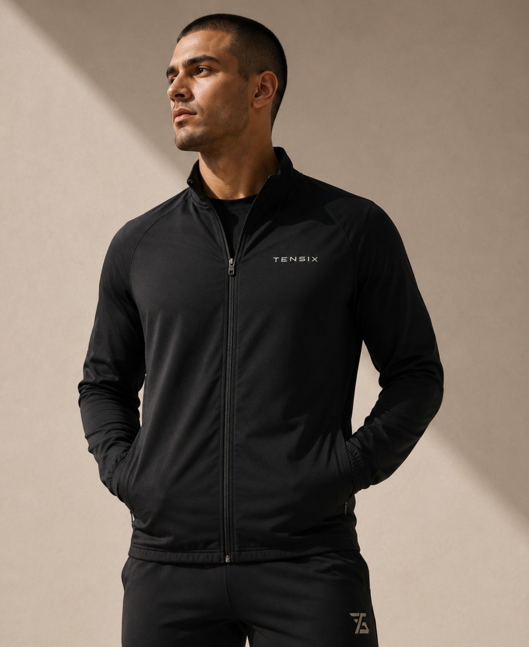 TENSIX athlete wearing black training jacket